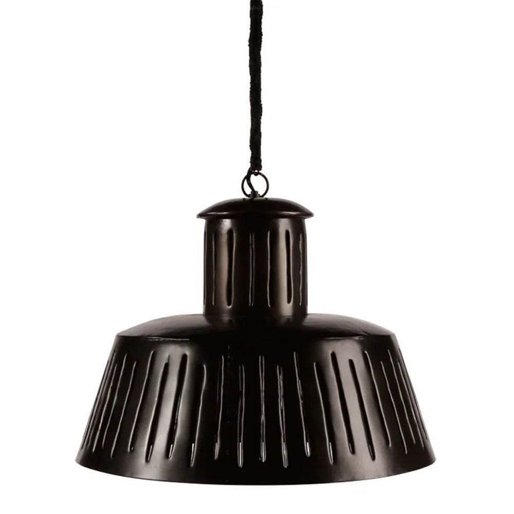 Close-up of black metal pendant light with slotted shade for modern industrial interiors.