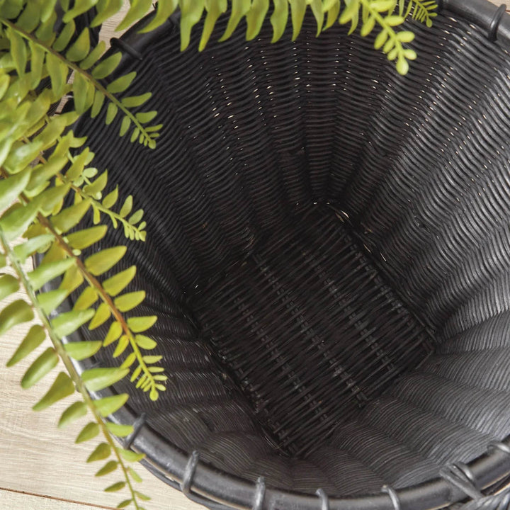 Top interior view of black rattan basket showing bound rim and woven base, sturdy construction and texture – Modern Boho.