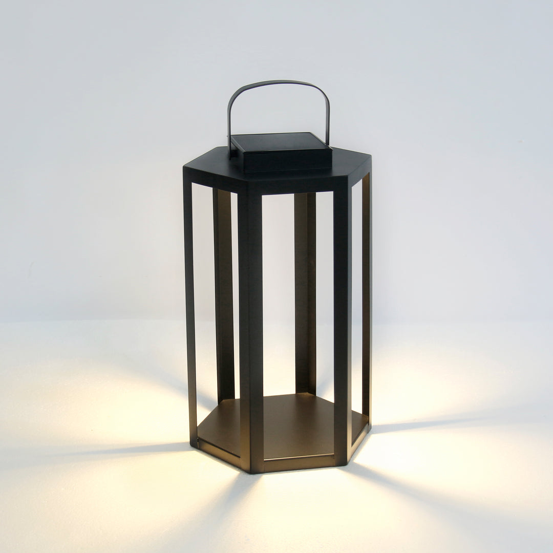 Black solar LED lantern with powder-coated iron frame, integrated solar panel, and warm 3000K illumination in an 18-inch height – Modern Coastal