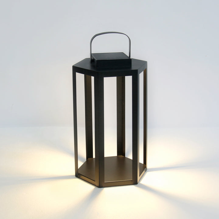 Black solar LED lantern with powder-coated iron frame, integrated solar panel, and warm 3000K illumination in an 18-inch height – Modern Coastal