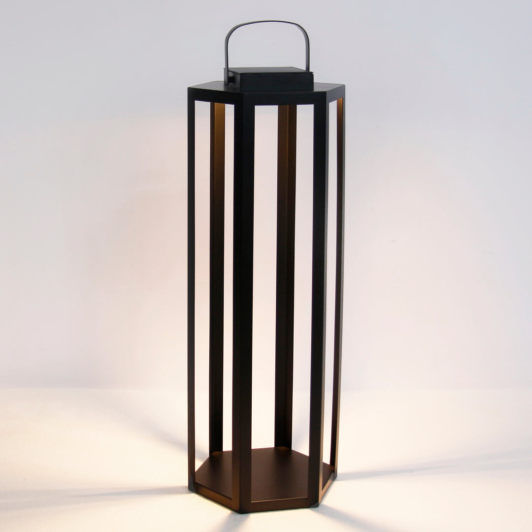 Black solar LED lantern with powder-coated iron frame, integrated solar panel, and warm 3000K illumination in a 30-inch height – Modern Coastal