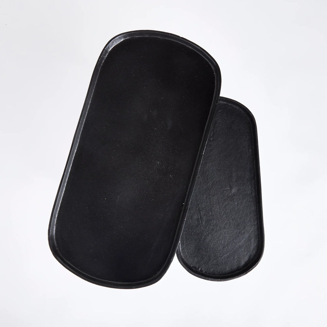 Black metal nesting end tables with tray-style tops, top view showing rounded edges and functional surface design – Modern