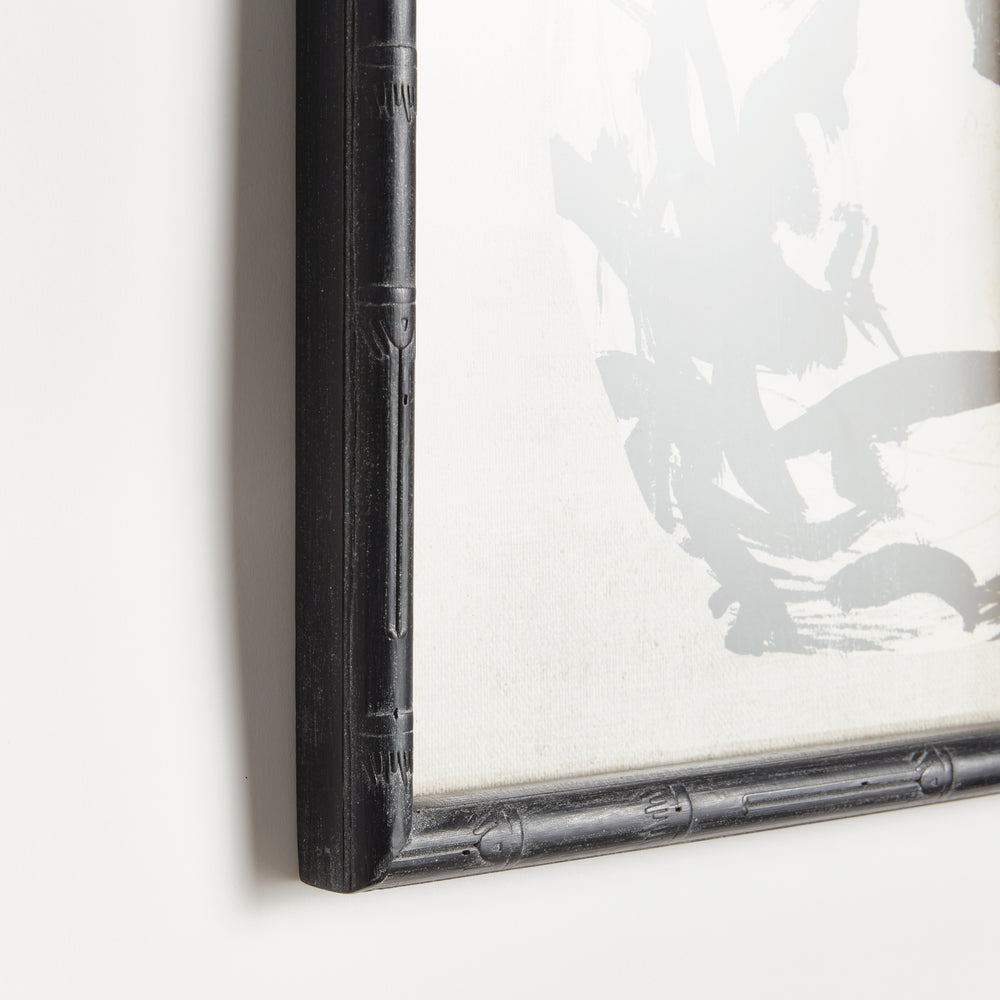 Close view of a black bamboo-style wood frame around a monochrome botanical print, showing its textured profile, Traditional