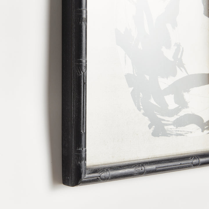 Close view of a black bamboo-style wood frame around a monochrome botanical print, showing its textured profile, Traditional