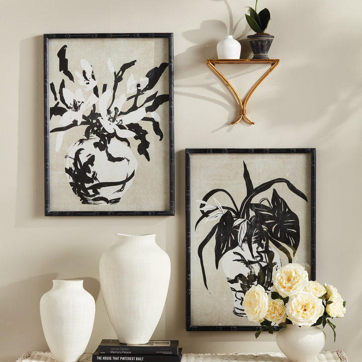 Black and white framed botanical prints arranged with white ceramics, flowers and a gold wall shelf in a room, Traditional
