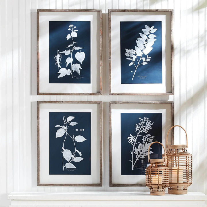 Cyan botanical wall art displayed in a sunlit room with panel walls, styled with rattan lanterns for a modern classic look.

