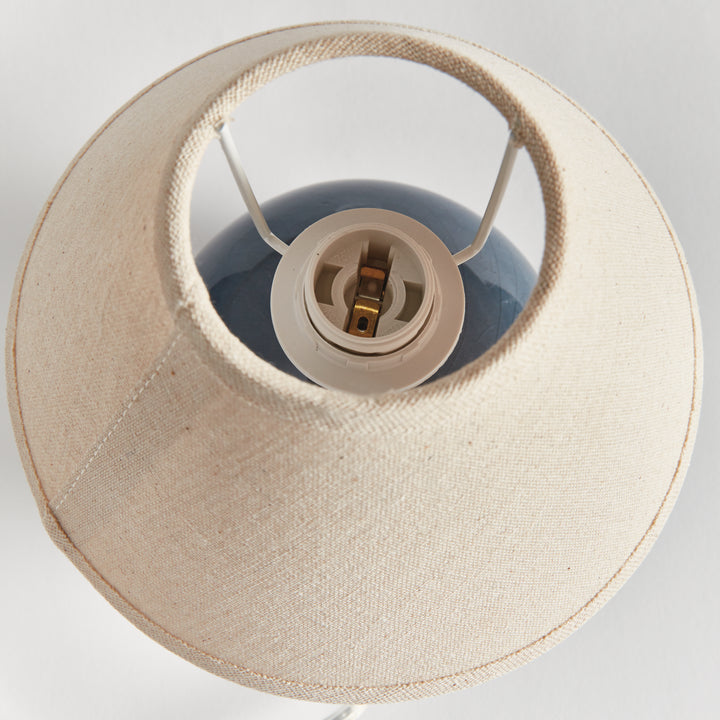 Blue ceramic mini table lamp viewed from above, showing the open linen shade and central bulb socket - Coastal Transitional