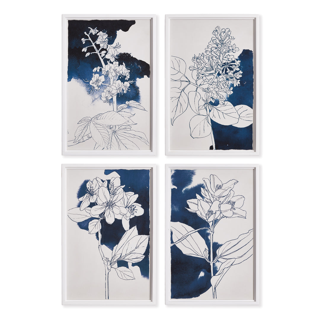 Set of four blue floral wall art prints displayed in a gallery arrangement on a white wall.


