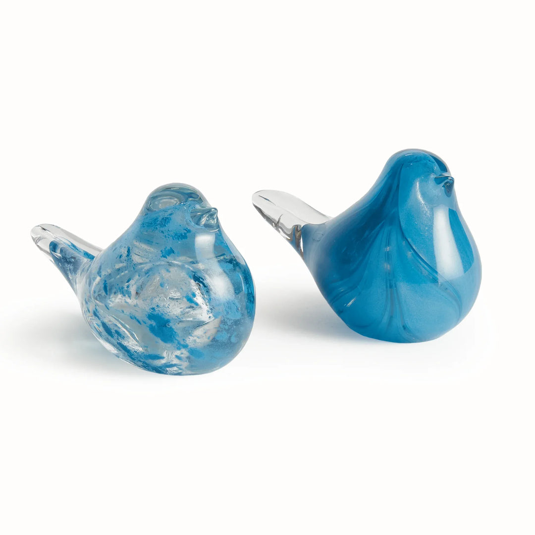 Pair of hand blown blue glass finch sculptures showing contrasting finishes, small decorative bird accents for tabletop display.