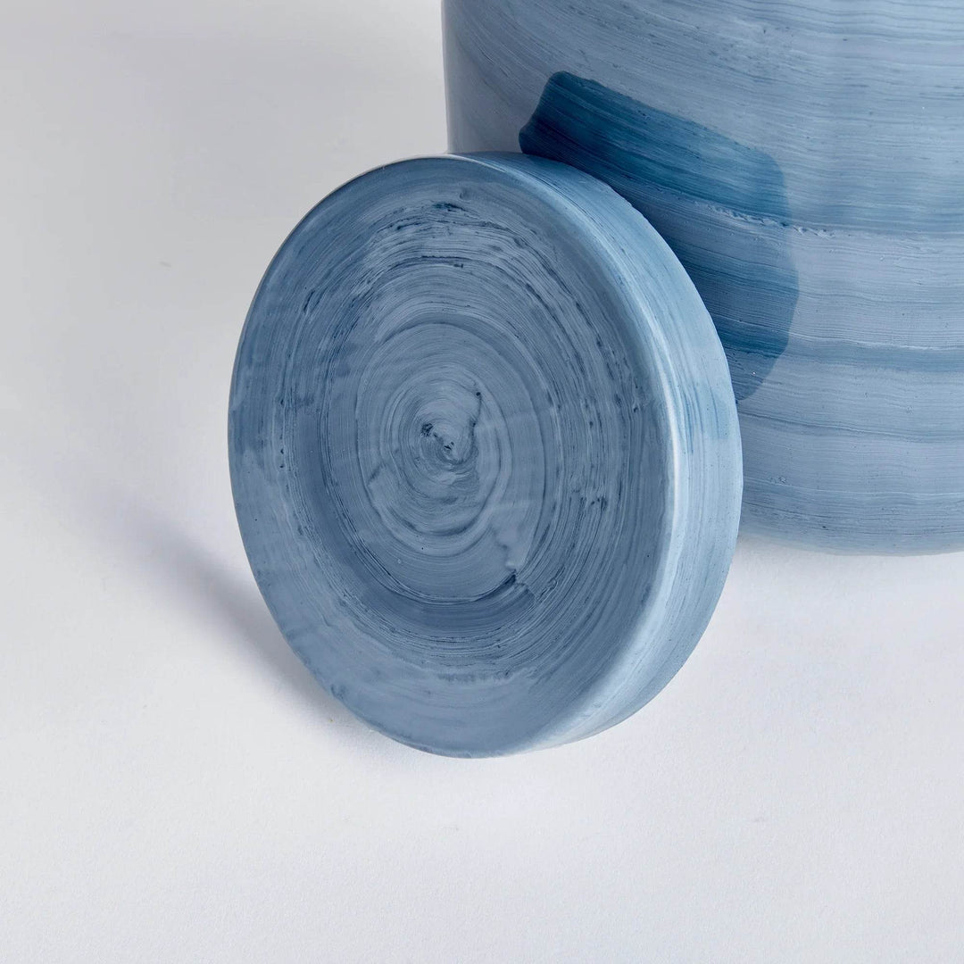 Close-up of removable lid from small iron ginger jar, showing circular hand-painted blue gray enamel finish – Coastal