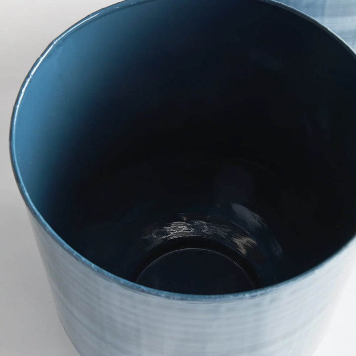 Interior view of blue gray iron storage table with glossy enamel finish, highlighting removable top design – Coastal