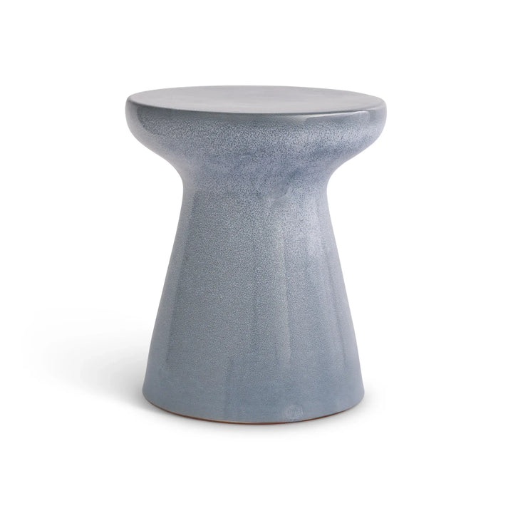 Blue reactive glaze ceramic side table with a round top and flared pedestal base, shown against a pale backdrop, Contemporary