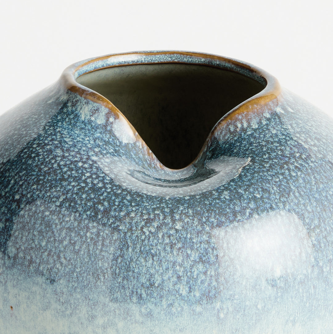 Close-up of reactive glaze texture and organic rim detailing on decorative stoneware vase – Modern Organic