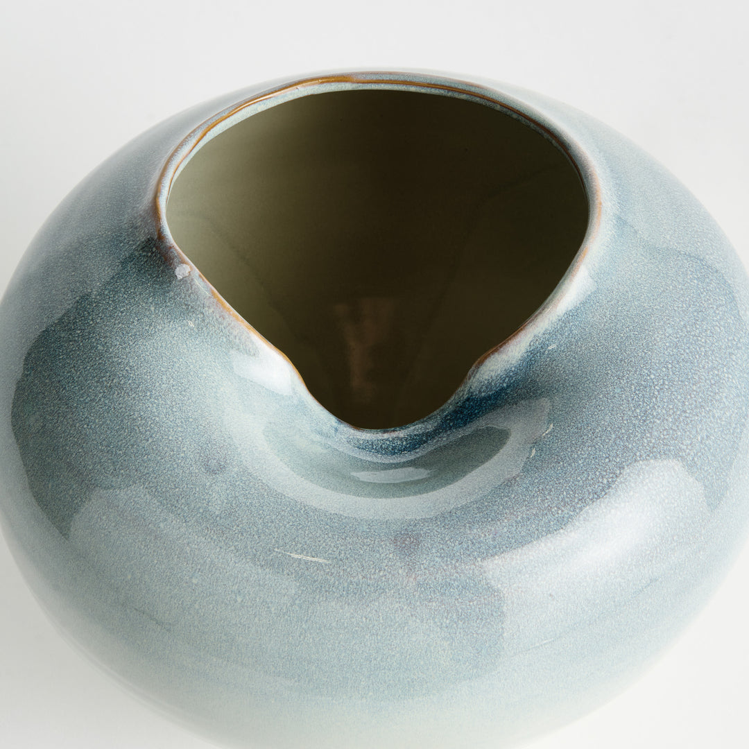 Detailed view of sculpted rim and opening on blue reactive glaze stoneware decorative vase – Modern Organic