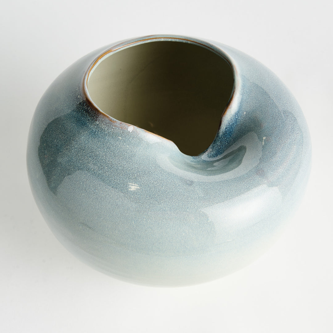 Blue reactive glaze stoneware vase with asymmetrical opening shown in detailed close-up view – Modern Organic