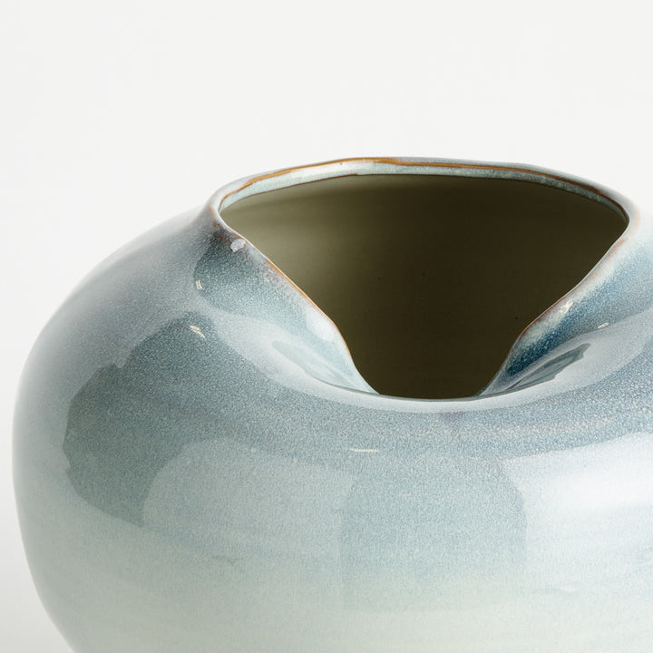 Close-up detail of blue reactive glaze stoneware vase showing sculpted indented opening – Modern Organic