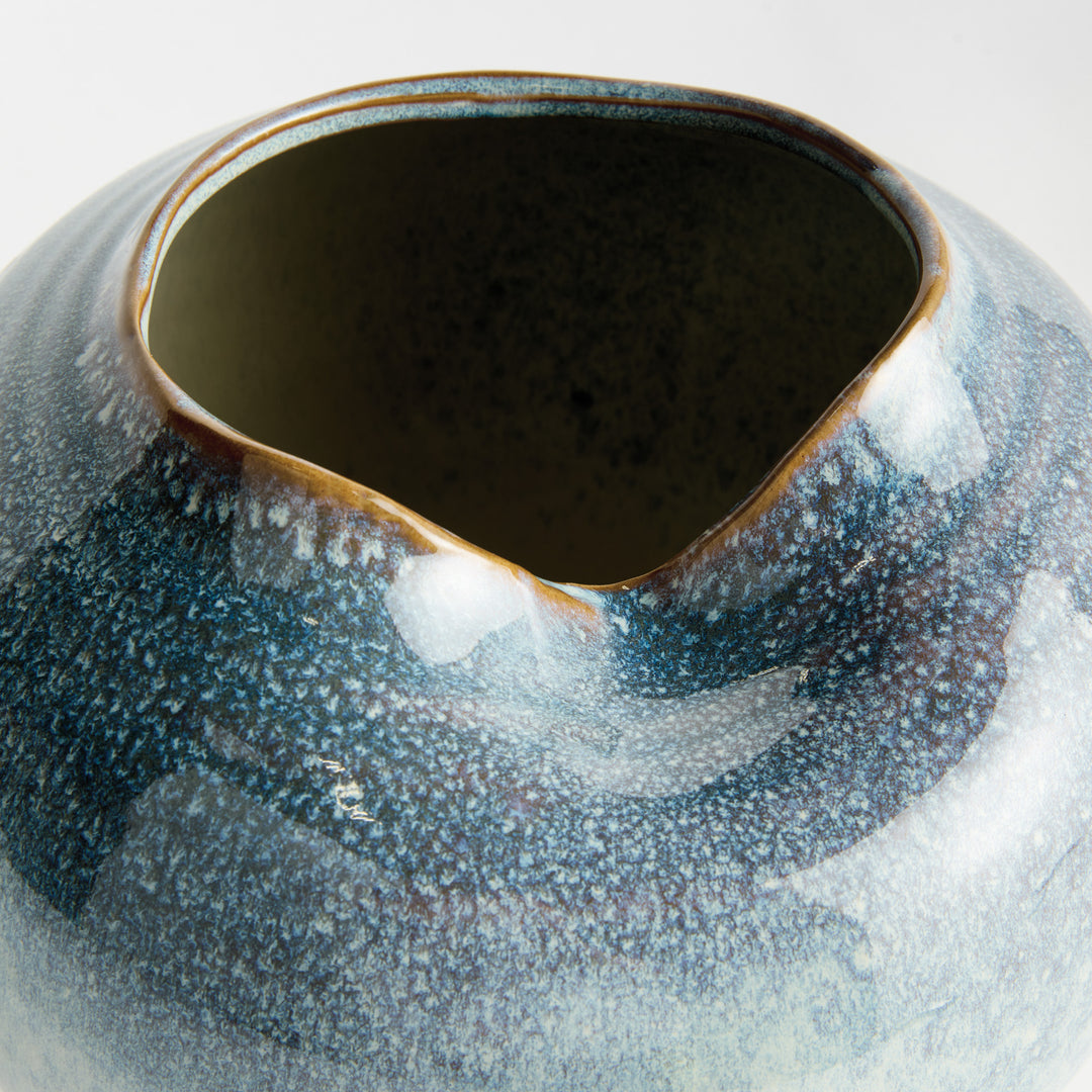 Detailed view of the sculpted rim and handcrafted contours of a blue stoneware vase – Modern Organic