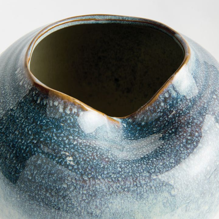 Detailed view of the sculpted rim and handcrafted contours of a blue stoneware vase – Modern Organic