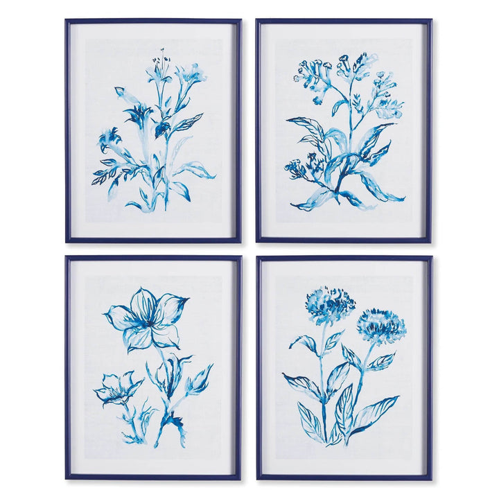 Close-up of blue and white botanical wall art set with watercolor floral detailing in a modern coastal frame.


