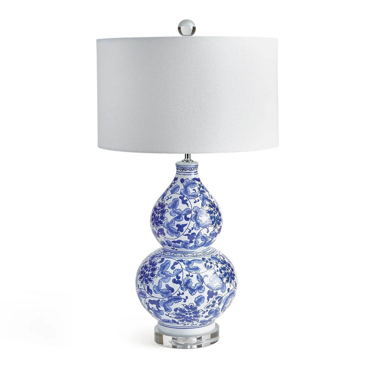 Classic coastal blue and white chinoiserie lamp with gourd-shaped ceramic base and white shade.