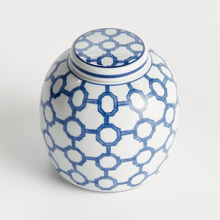 Angled view of blue and white ceramic ginger jar with fitted lid and geometric link pattern, small decorative accent – Coastal.