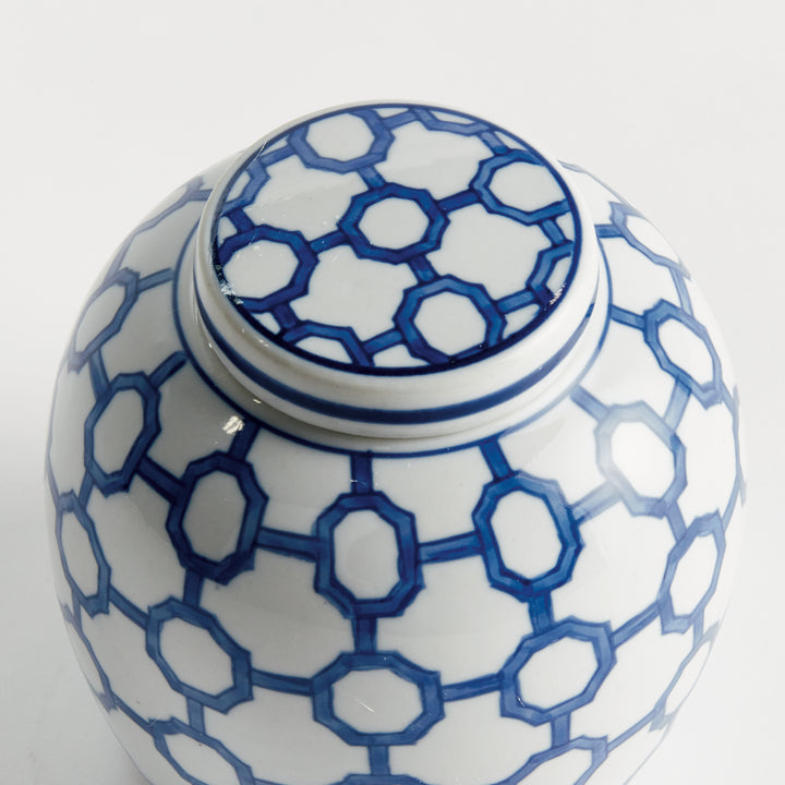 Top view of blue and white ceramic ginger jar lid showing hand-finished geometric link pattern and glossy glaze – Coastal.