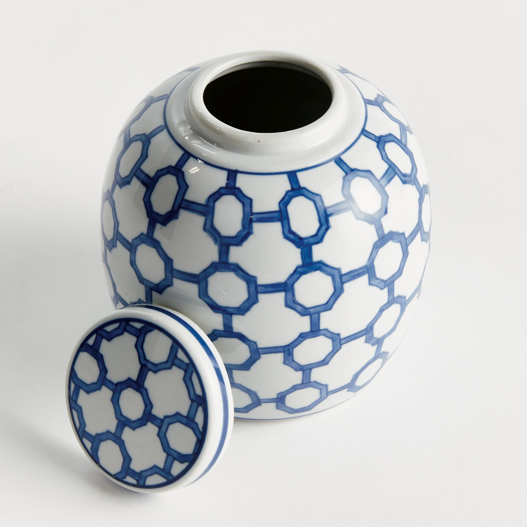 Blue and white ceramic ginger jar with geometric link pattern, round body and removable lid, decorative tabletop accent – Coastal.