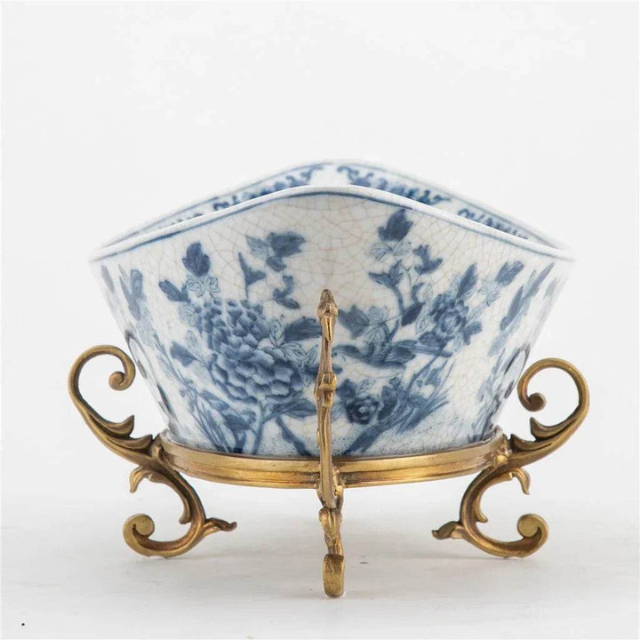 Blue and white porcelain decorative bowl with bronze ormolu base, front view