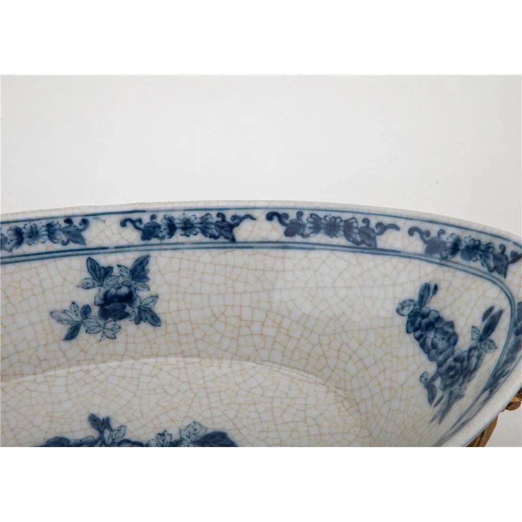 Interior view of blue and white porcelain decorative bowl with floral and bird patterns

