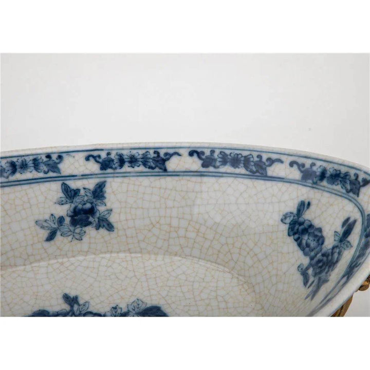Interior view of blue and white porcelain decorative bowl with floral and bird patterns

