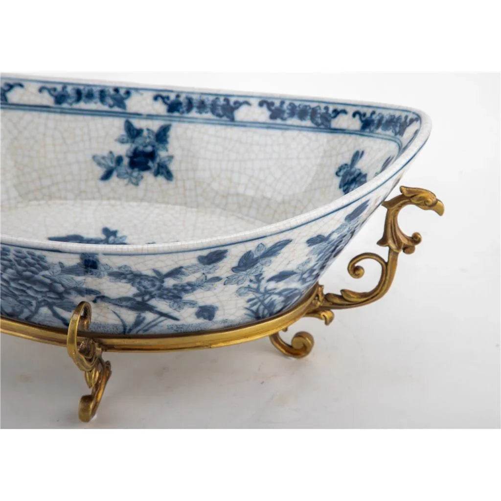 Blue and white porcelain decorative bowl showing floral pattern and crackle glaze rim detail


