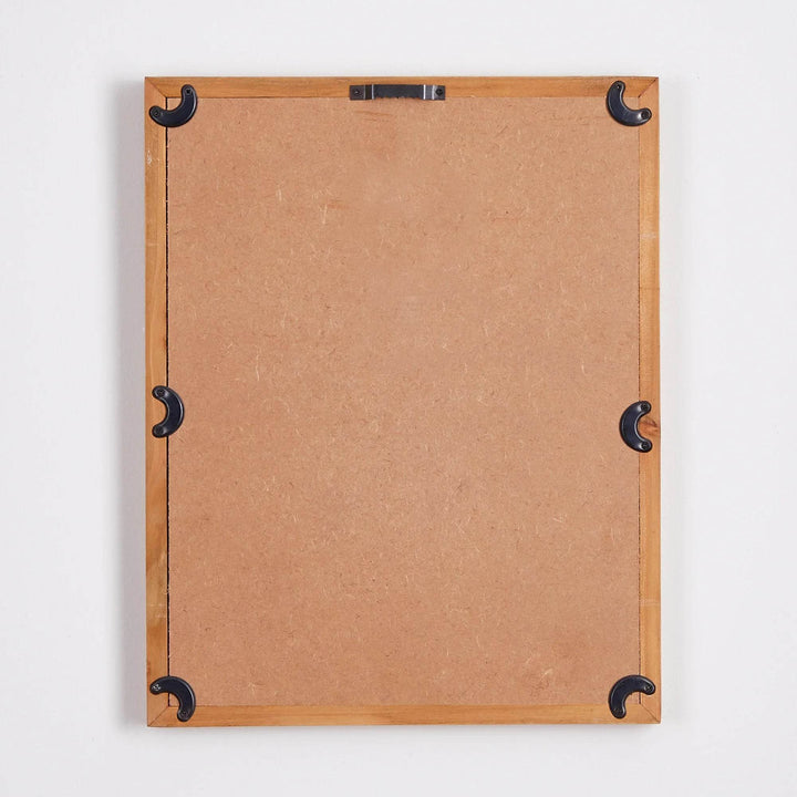 Backside of one framed blush botanical print with black mounting hardware
