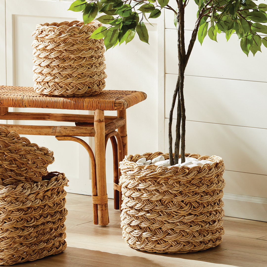 Handwoven abaca French braid baskets styled on entryway bench, showing natural tan fiber and artisan texture – Boho Home Décor