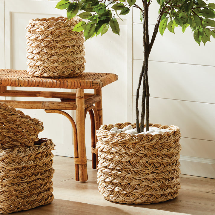 Handwoven abaca French braid baskets styled on entryway bench, showing natural tan fiber and artisan texture – Boho Home Décor