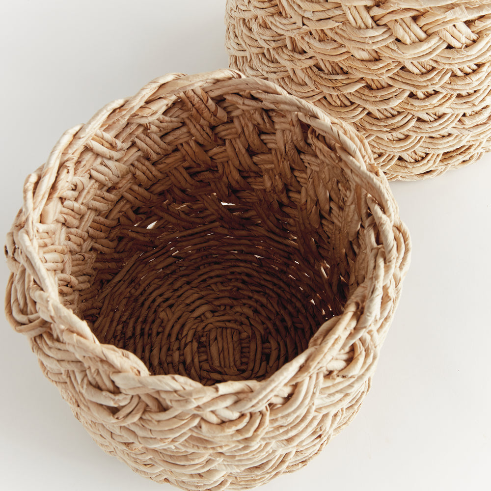 Overhead view of natural abaca basket showing round shape and hand-braided French weave interior detail – Boho Woven Basket