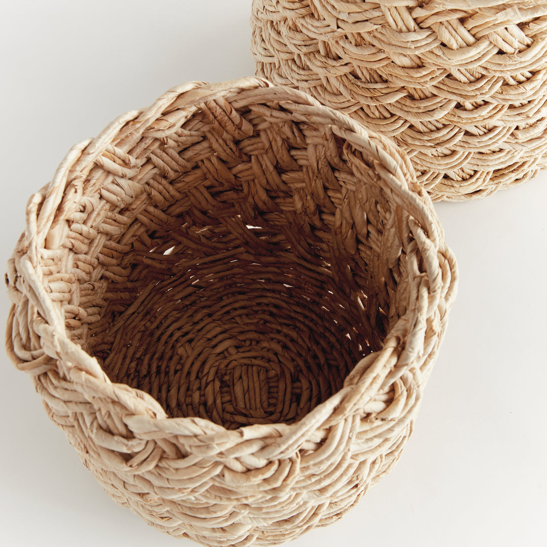 Overhead view of natural abaca basket showing round shape and hand-braided French weave interior detail – Boho Woven Basket