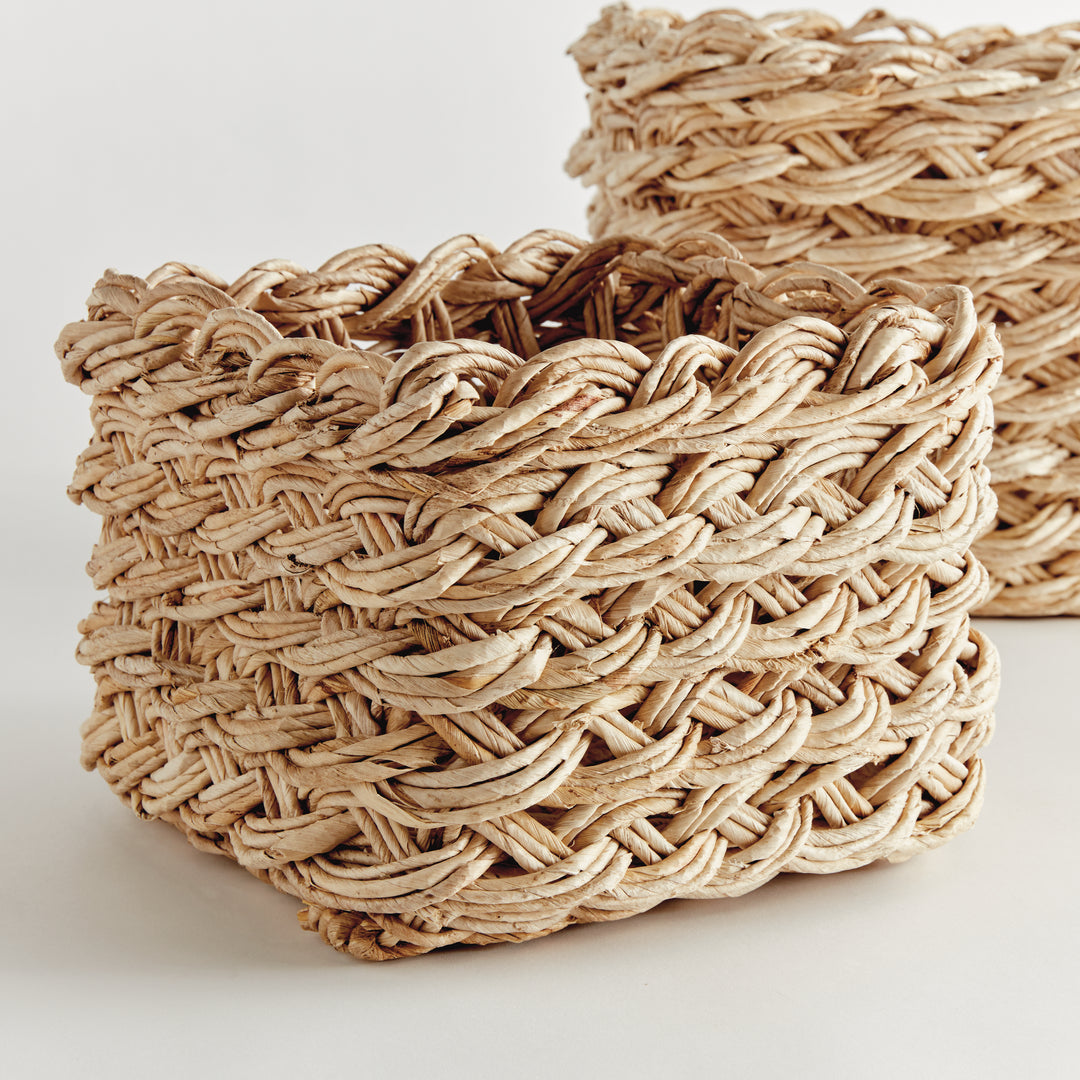 Angled view of handwoven square abaca storage baskets in natural tan, highlighting thick braided weave – Boho Woven Basket