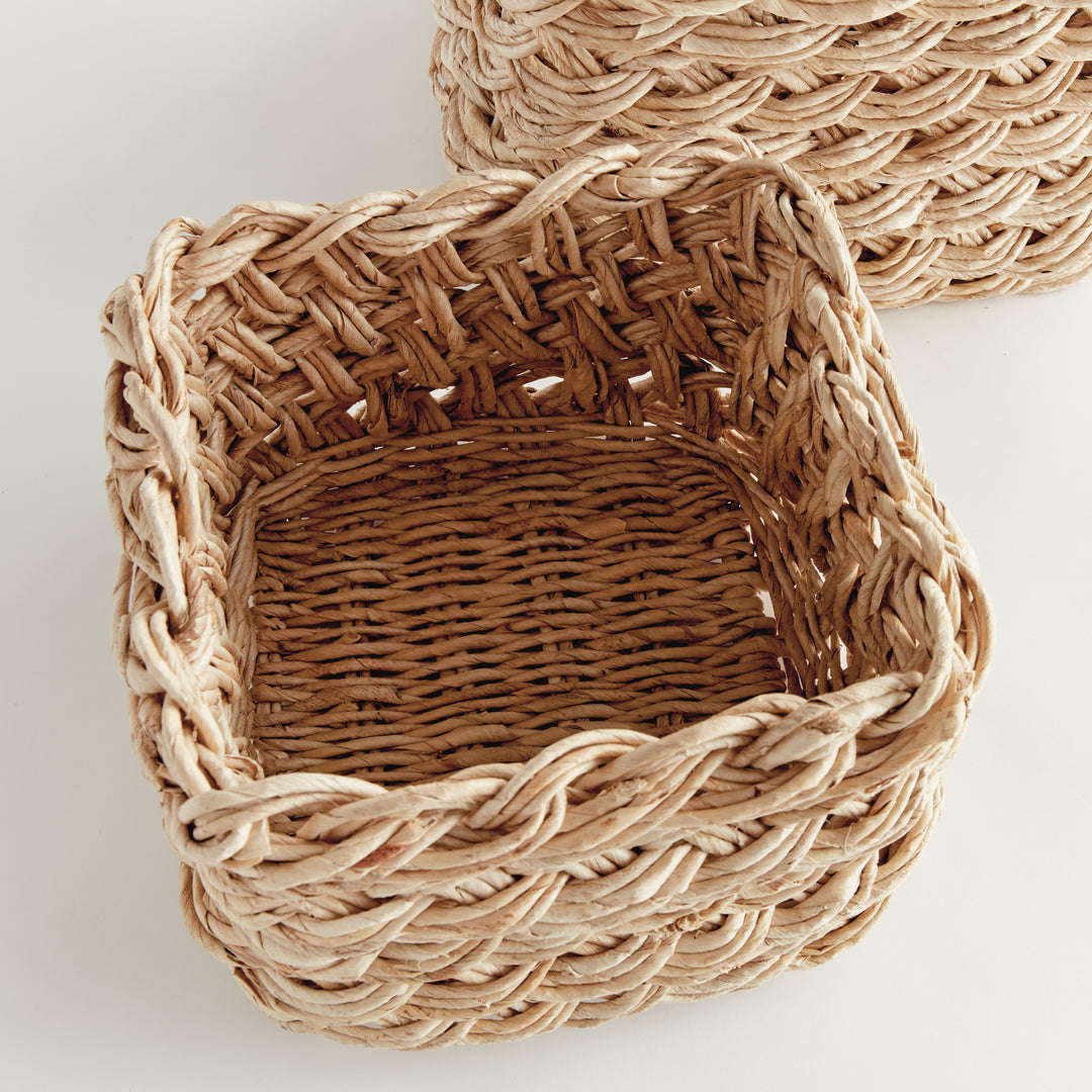 Overhead view of square abaca French braid basket showing handwoven natural fiber interior – Boho Decorative Baskets