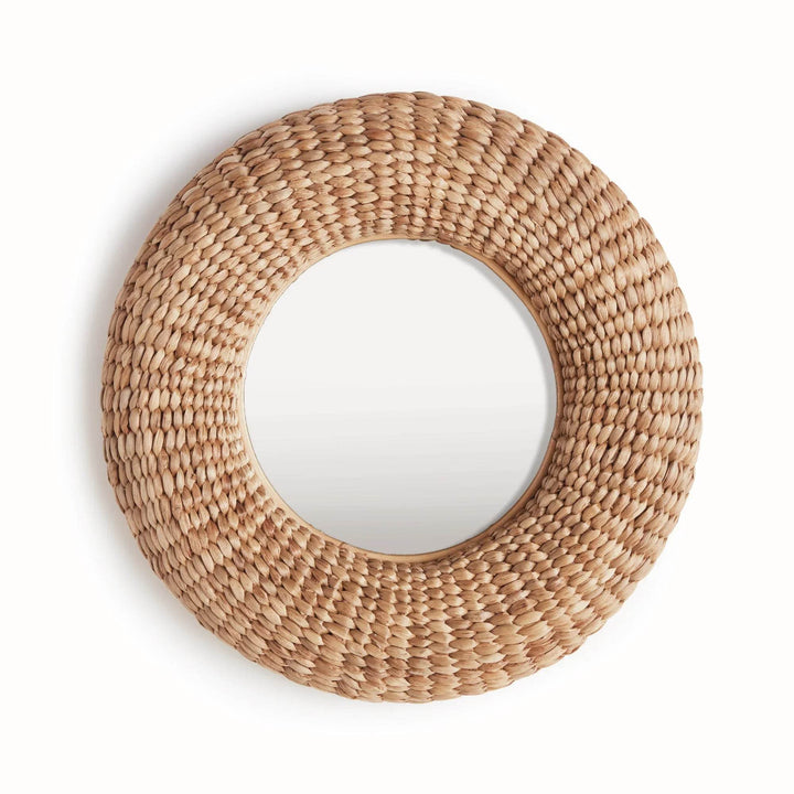 Handwoven round wall mirror in natural seagrass finish, perfect for coastal boho or modern farmhouse entryway decor.