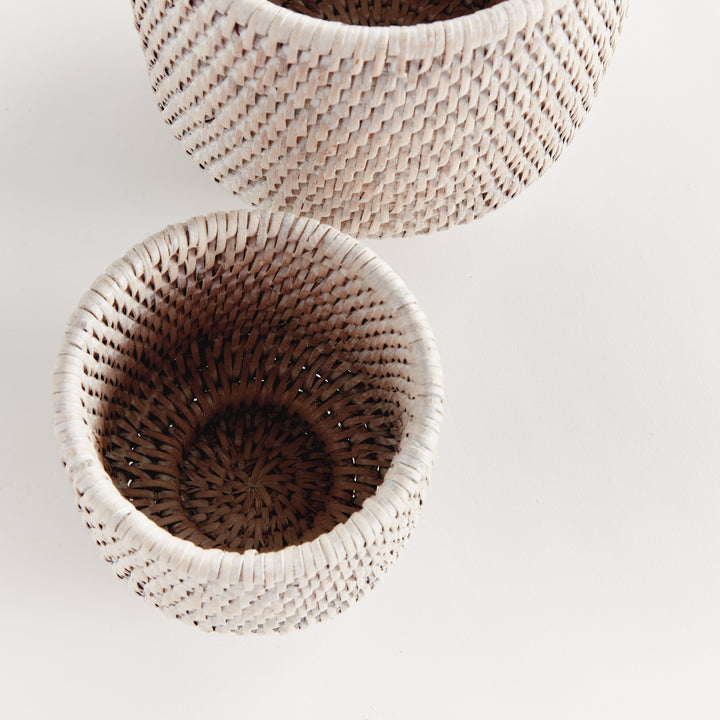 Whitewash rattan cachepots viewed from above, showing woven interiors and the pattern in the base - Coastal Transitional