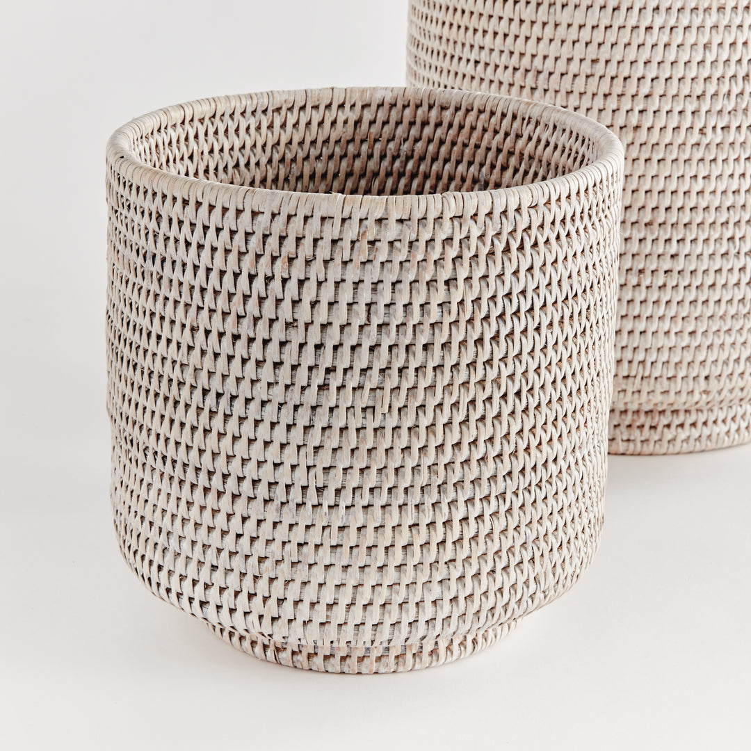 Whitewash rattan cachepot set close-up showing woven sides, rounded rims and raised circular feet - Coastal Transitional