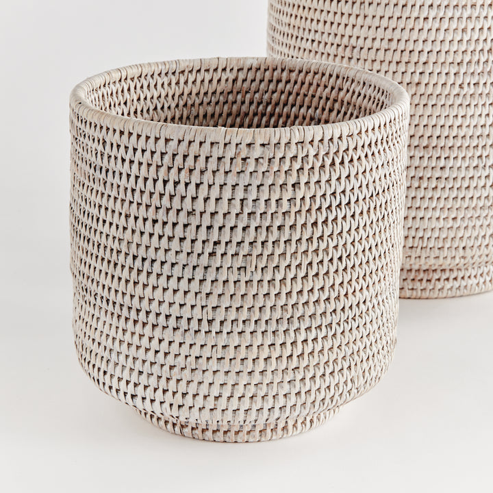 Whitewash rattan cachepot set close-up showing woven sides, rounded rims and raised circular feet - Coastal Transitional