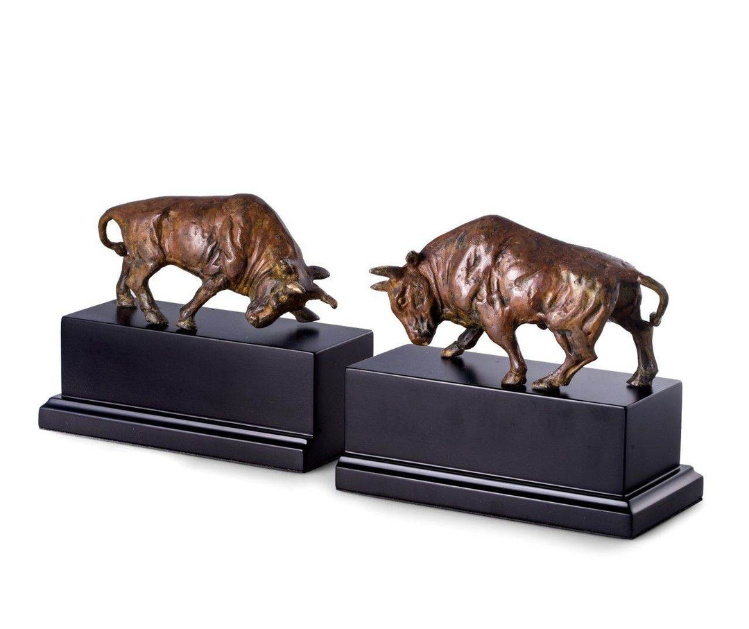 Set of brass bull bookends in flamed patina finish on black wood bases, 6.75 inches tall, angled display highlighting sculptural detail – Decorative Sculptural.