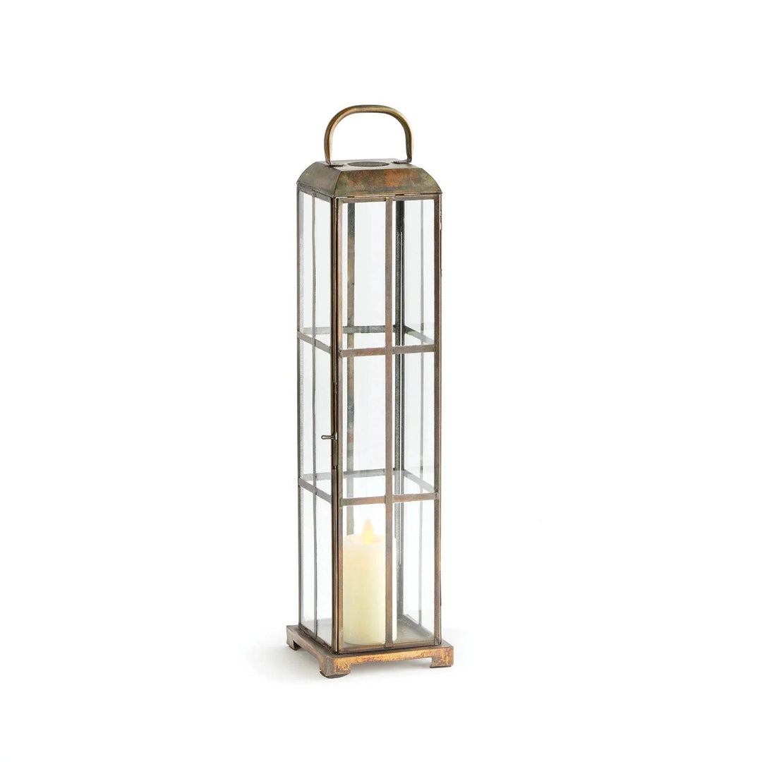 Slim brass and glass lantern with antique finish, shown with pillar candle inside, 19.75 inches high – Modern Farmhouse
