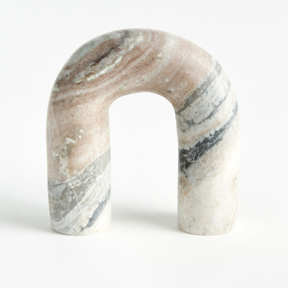 Front detail of a brown and white marble arch sculpture with an open center, rounded top and honed surface. Modern Organic