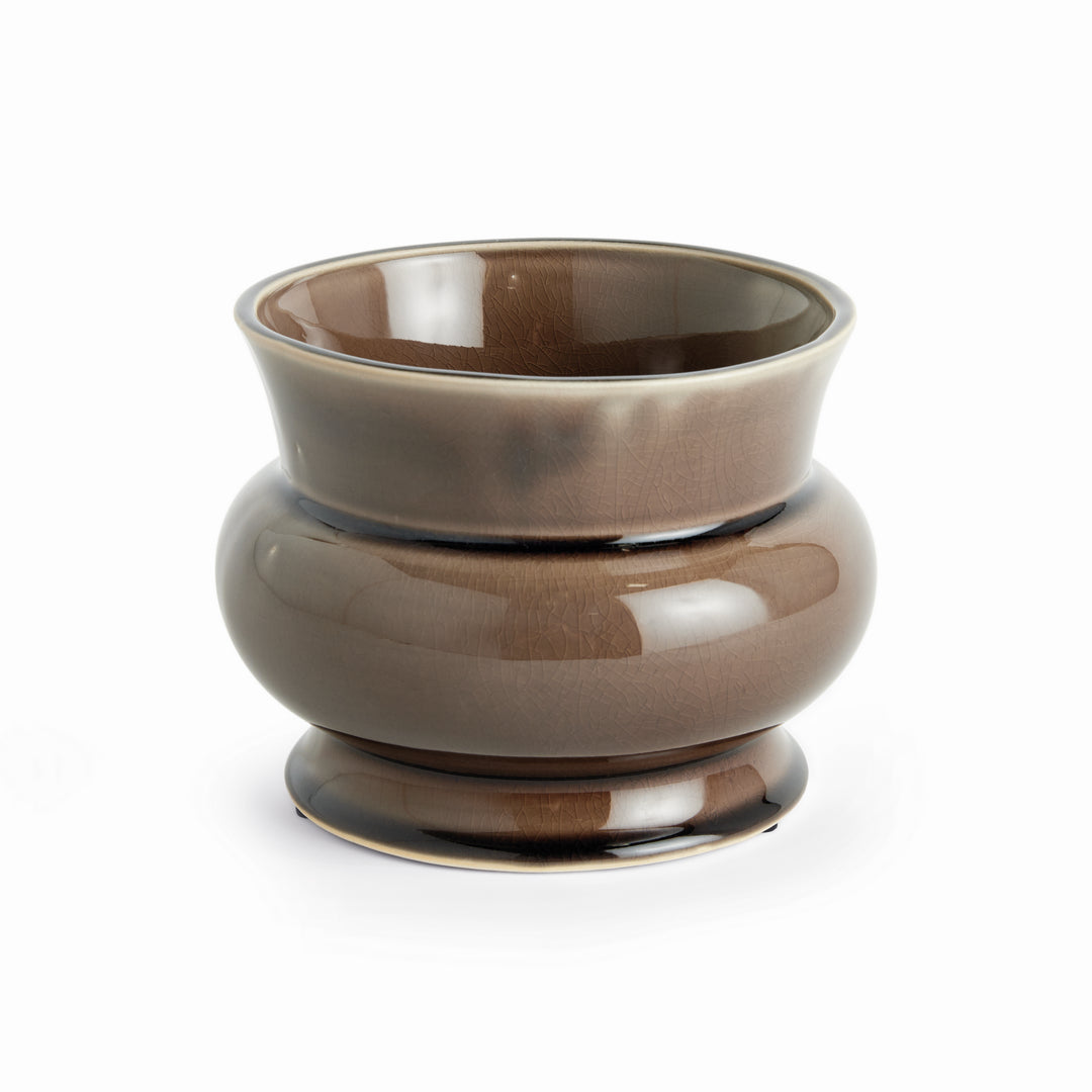 Brown ceramic cachepot with a glossy reactive glaze, rounded English-inspired silhouette, and drain hole for indoor plants – English Country