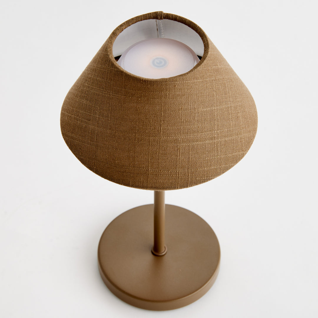 Top view of brown cordless LED table lamp showing touch control surface and linen empire shade – Coastal Transitional