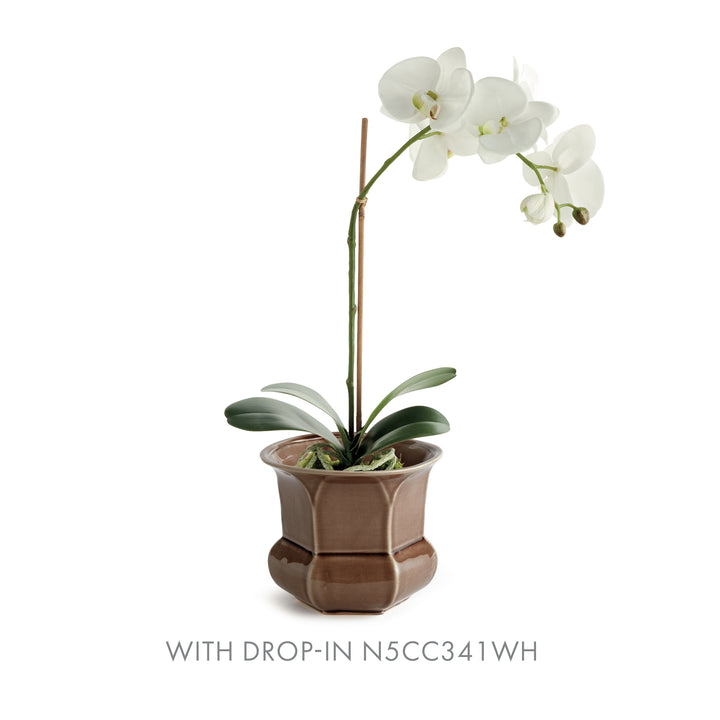 Brown faceted ceramic planter paired with a white orchid drop-in, showing its flared rim and rounded lower body, Traditional