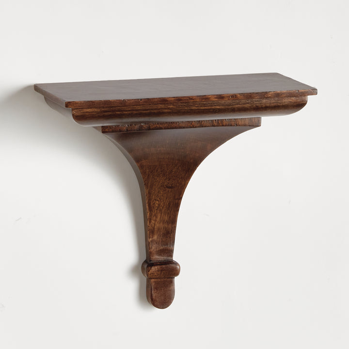 Antique brown wall-mounted display shelf with soft taper and architectural profile, shown in clean side-angle studio setting.

