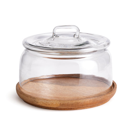 With a classic shape and simple handle, this cloche houses cheese, pastries or rolls. Sitting atop a natural wood board, it makes for easy entertaining.